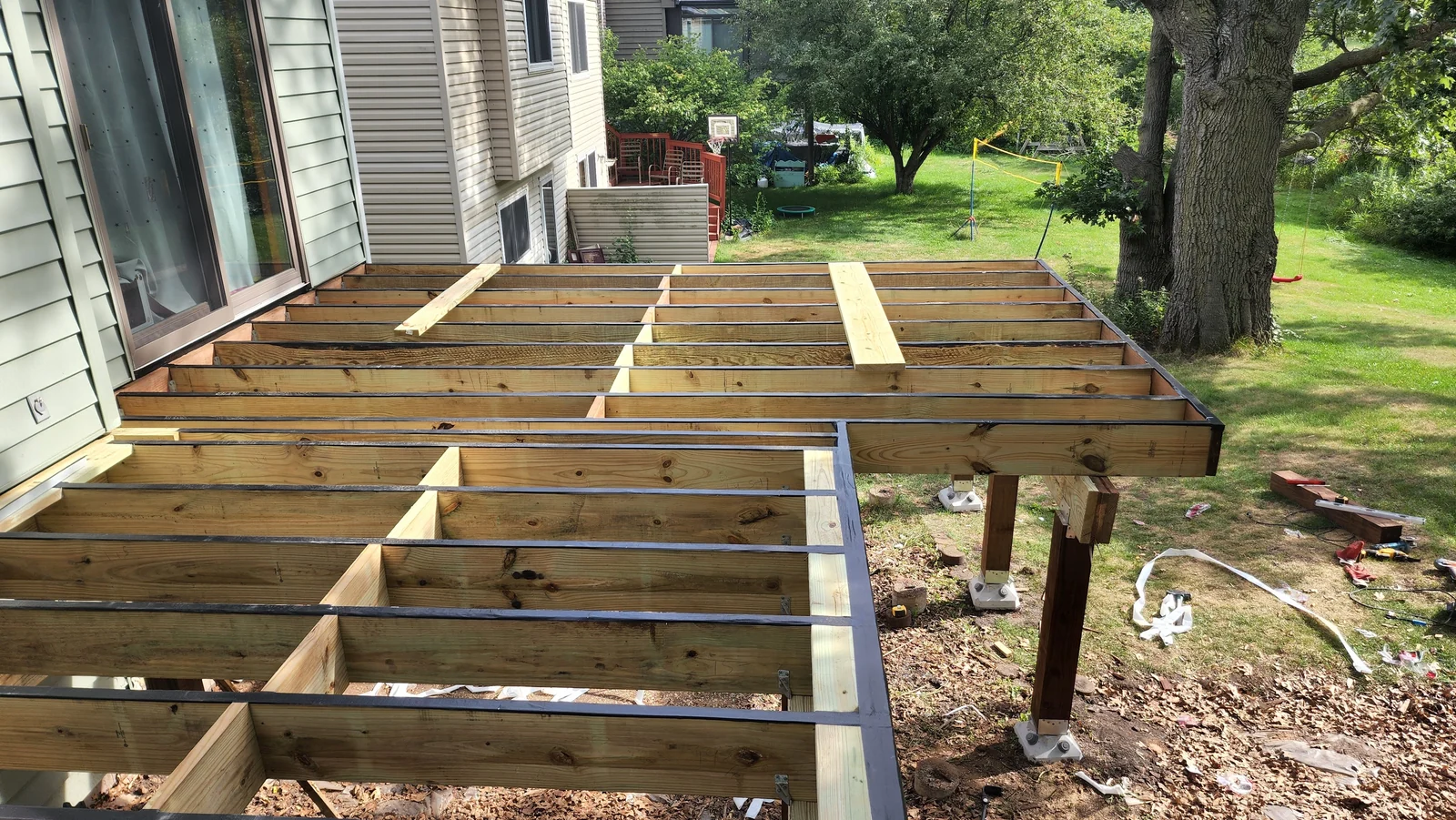 Deck framing layout in progress before boards are installed